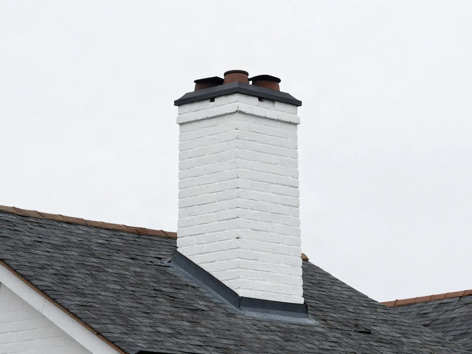 Brick chimney on a home served by Oak River Chimney Sweeps Inc. in Berlin, CT